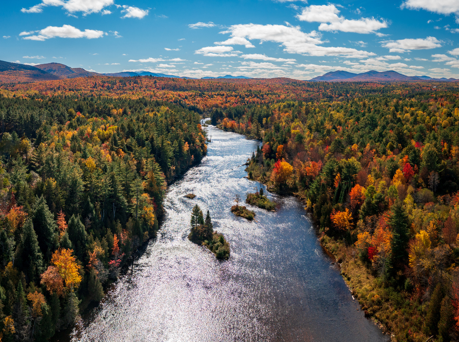 Saranac River Flows through Multi-Colored Fall Landscape in Adirondacks NY